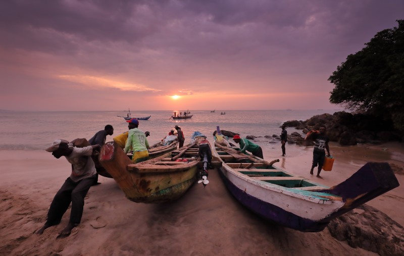 Ghana, fishing boats at sunrise