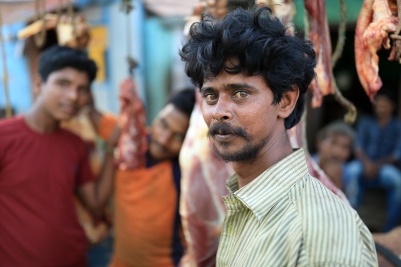 Mmeat seller on a market, India